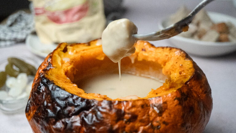 Pumpkin stuffed with cheese fondue (vegan)